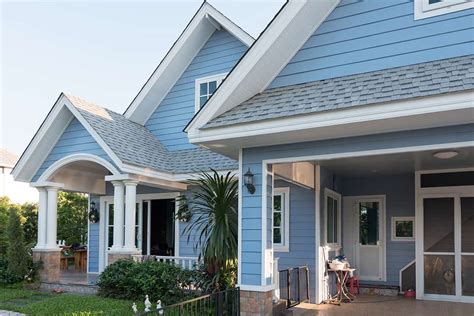 blue house with white metal roof|white house blue trim.